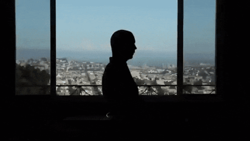 A GIF of Jonathan Blow in a dark room.